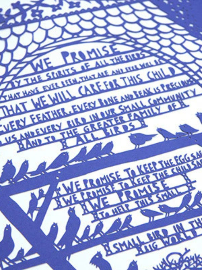 'We promise to keep the child safe' blue lasercut. Closeup of intricate blue lasercut artwork featuring the inside of a bell tower containing birds and text.