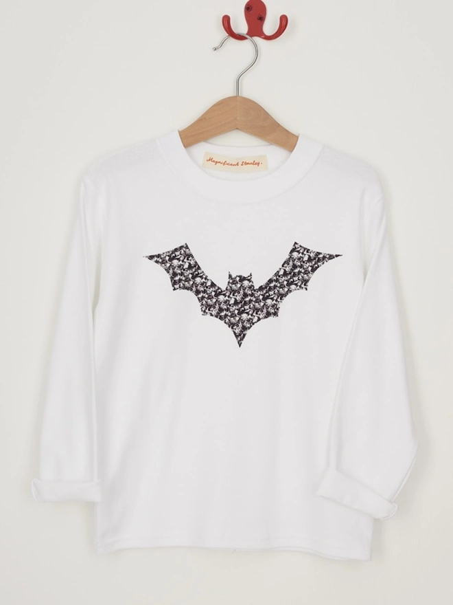 a white cotton t-shirt with a monochrome Liberty fabric bat sewn on the front. 