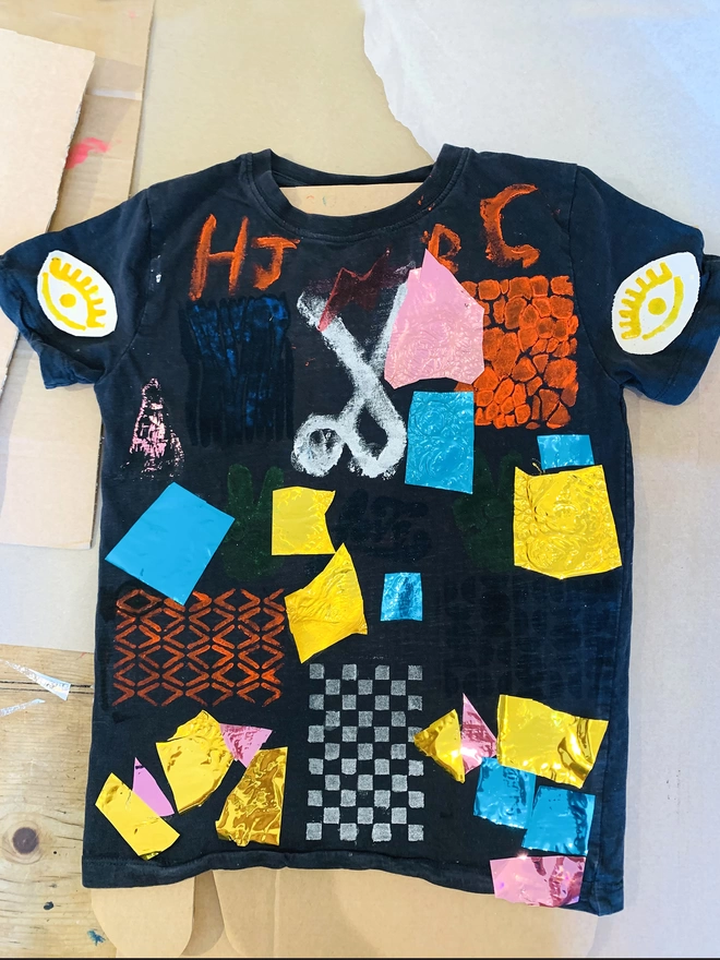 A t-shirt designed by kids with metallic foil and ink