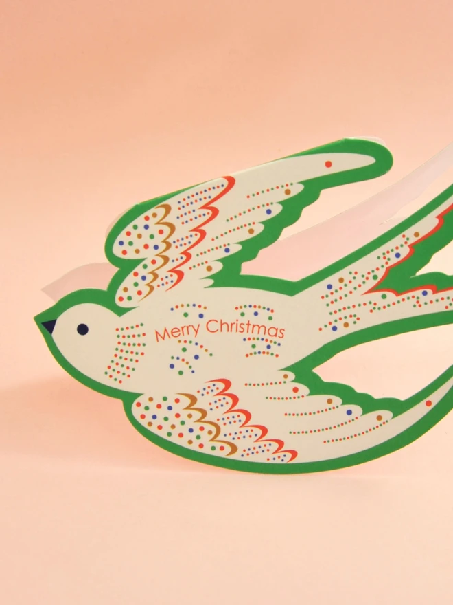 Die cut bird Merry Christmas card.