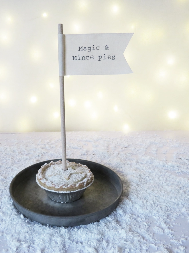 organic cotton flag with hand painted festive message wrapped round wooden dowel.