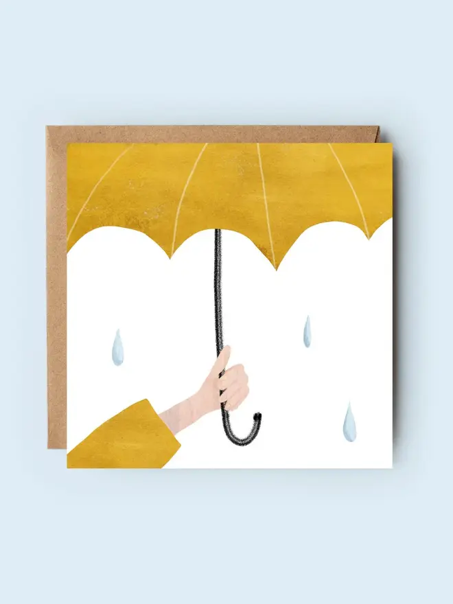 'under the weather' illustrated sympathy card. card photographed against plain blue backdrop.