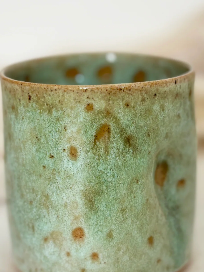 Pinch Mug. A close up of a Green Regular Pinch Mug.