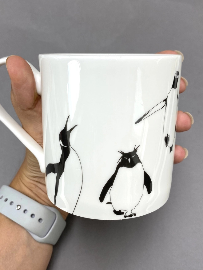 King and Rockhopper penguins on the hand decorated multi penguin mug