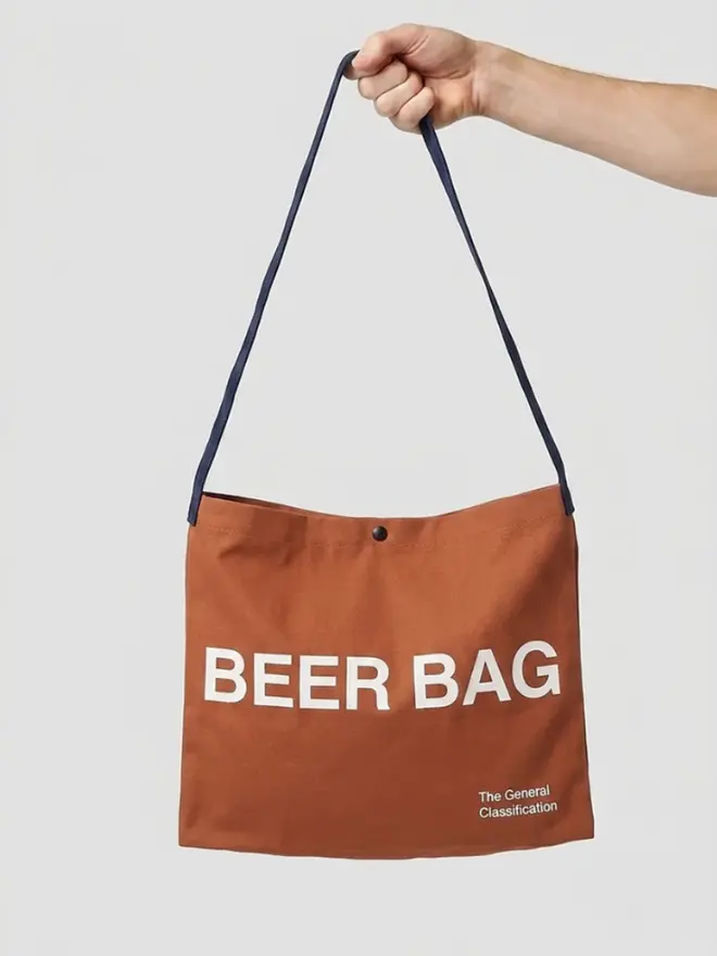 'Beer Bag' Musette Bag, against a grey background. 