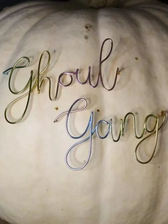 Ghoul Gang Wired Moments sign seen on a white pumpkin.
