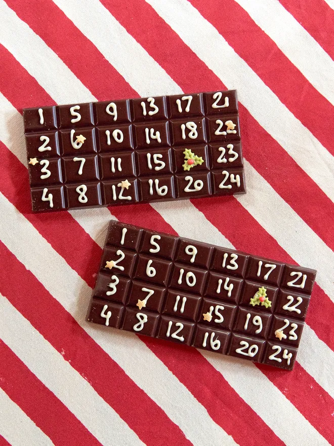A solid bar of chocolate hand piped with December dates from the 1st to the 24th. 