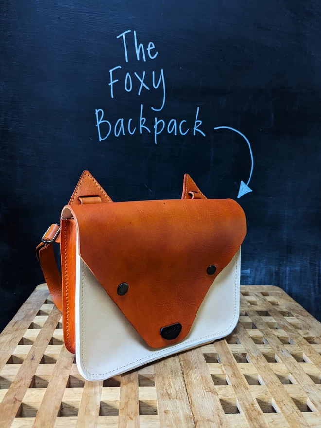 Hand-dyed leather orange and light tan fox backpack.