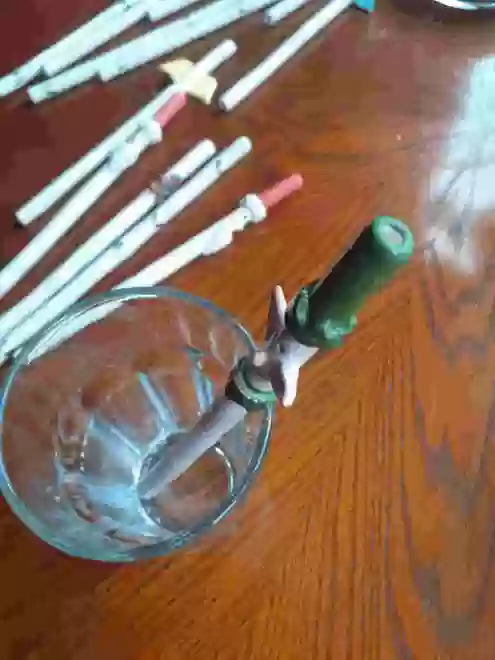Ceramic Elf Straw in a glass top veiw