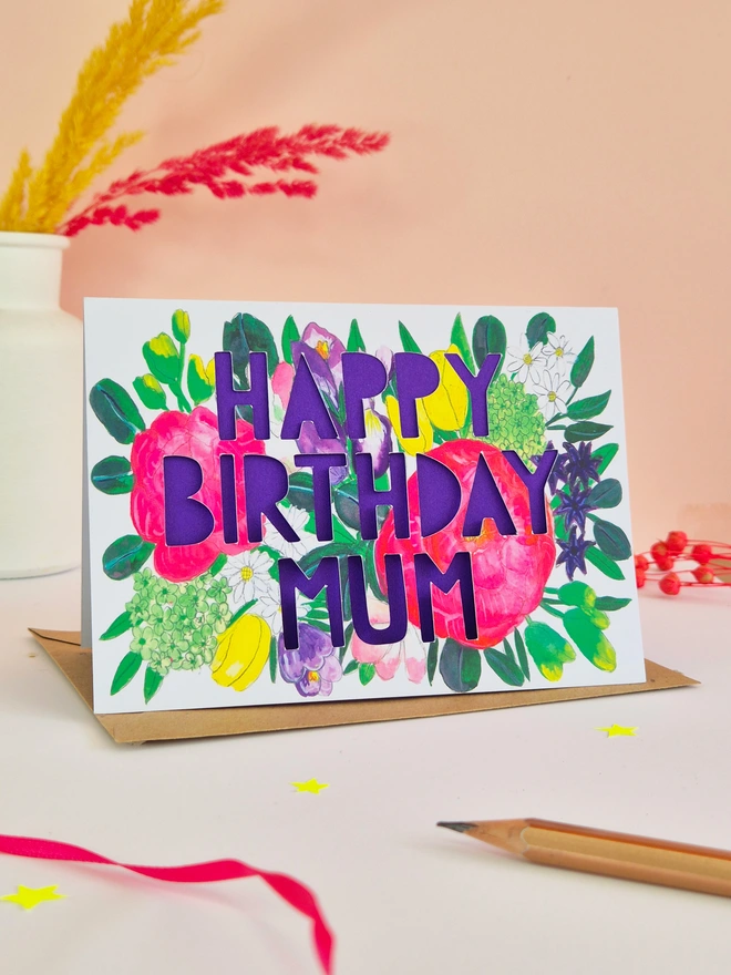Bright floral illustration printed card with Happy Birthday Mum text and bright purple liner