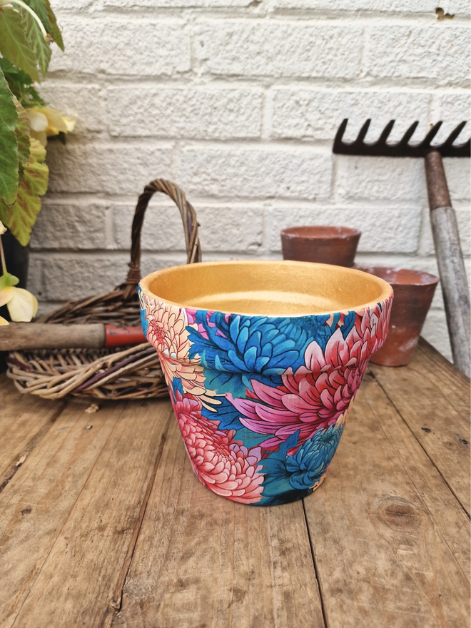 Chrysanthemum Plant Pot on a wooden bench