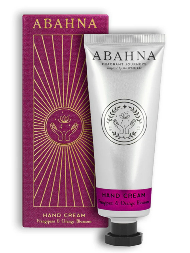 frangipani and orange blossom botanical hand cream. a pink box and silver tube containing hand lotion.