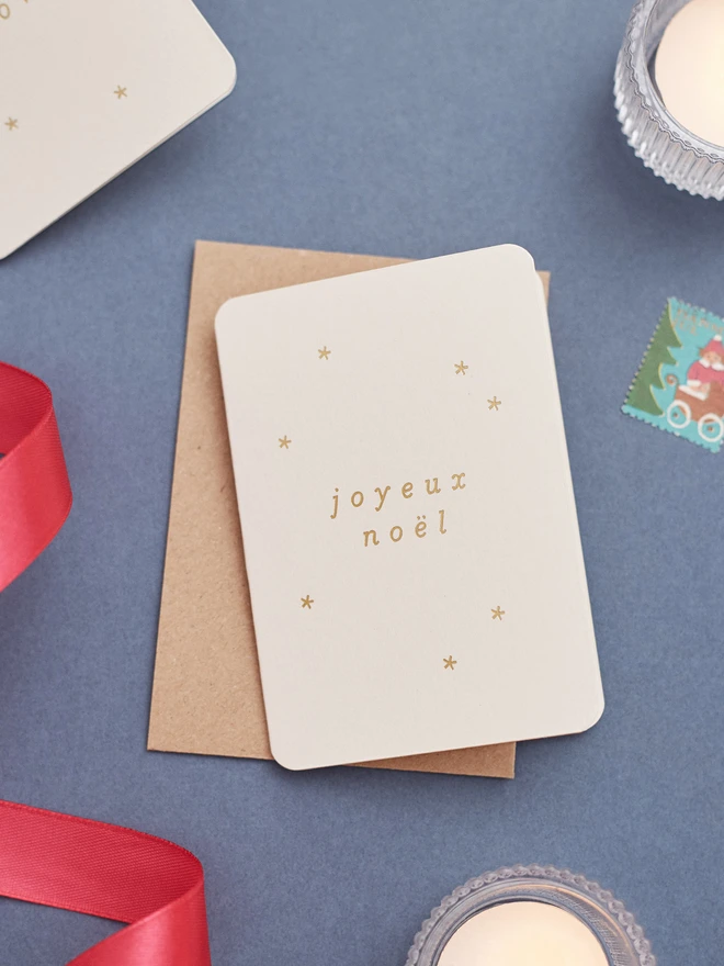 minimal-christmas-card-with-joyeux-noel-gold-foil-lifestyle CC-NOEL-GD.jpg