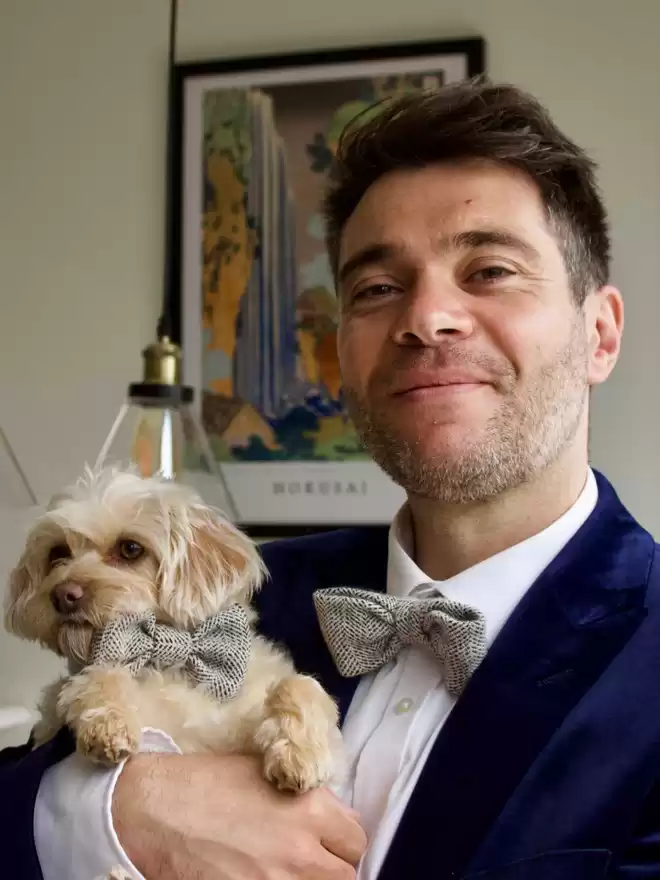 man and dog matching bow ties 