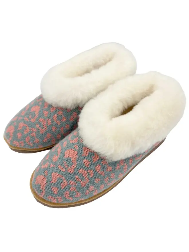 Women's Lambswool & Sheepskin Boot Slippers, a pair of boot slippers sitting on a plain white floor. 
