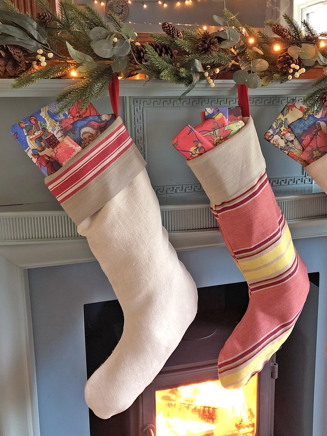 Christmas stockings hanging by fire