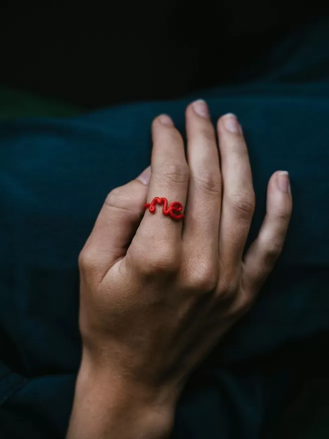 This Is 'Me' Statement Ring in red.