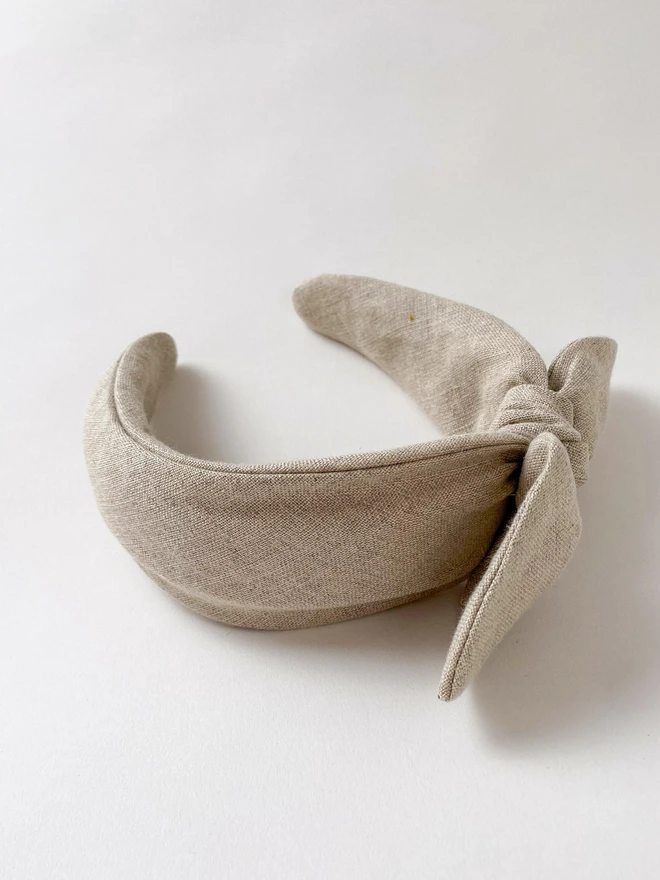 side view of natural biege linen headband for women