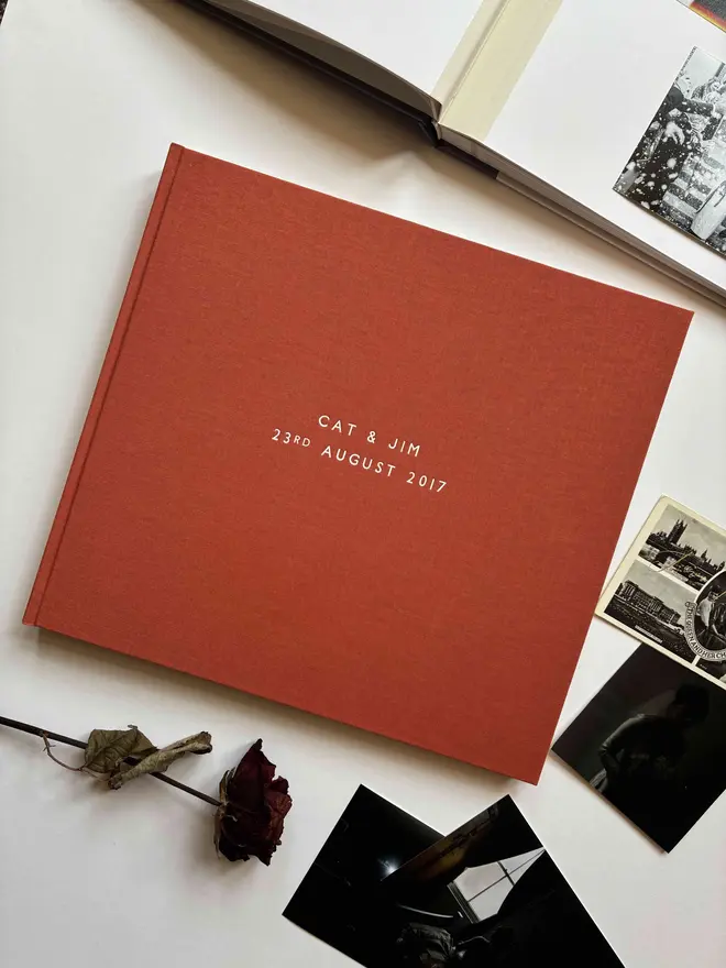 Handmade traditional wedding album by Keep Collect in Apricot book cloth with lettering in white foil