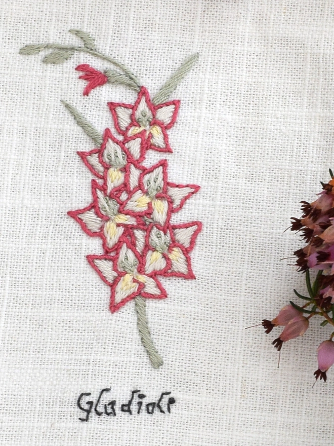 Floral Botanical embroidery kit of a magenta and ivory Gladioli or Gladiolus a symbol for August and 40th wedding anniversary.  Meaning Strength of Character, Honour, Respect, Generosity and Integrity.