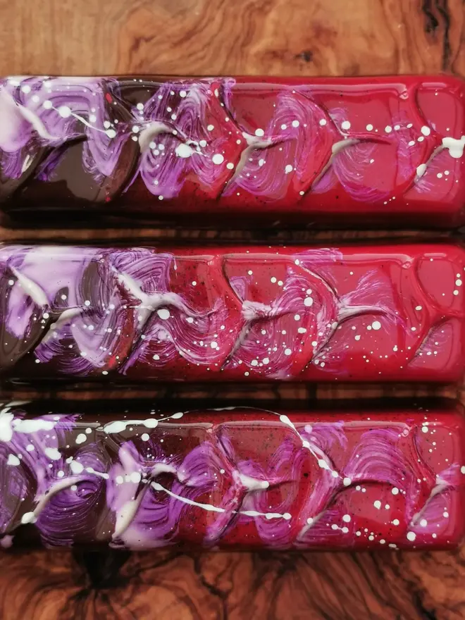 pink and purple chocolate bar with white paint splatter decor