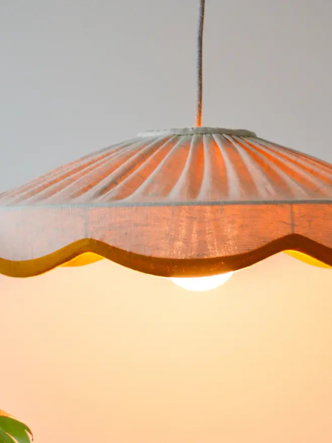 lit up natural linen and mustard lampshade