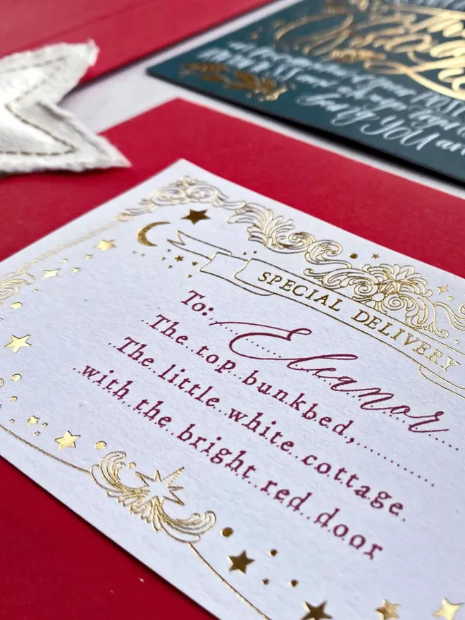 Close-up of a gold foil "Special Delivery" label addressed in red to Eleanor's top bunkbed.