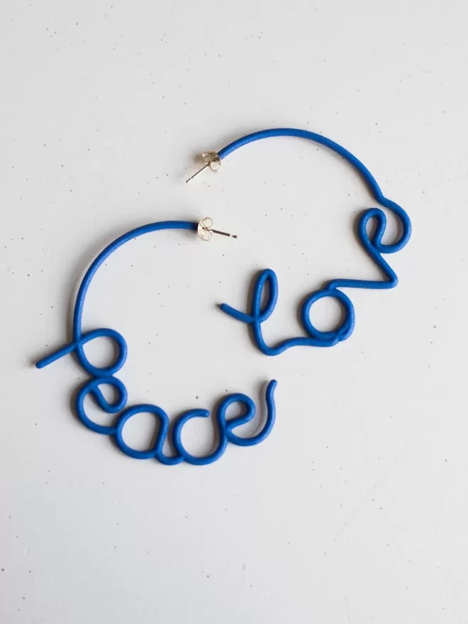 Love and Peace large blue earrings.