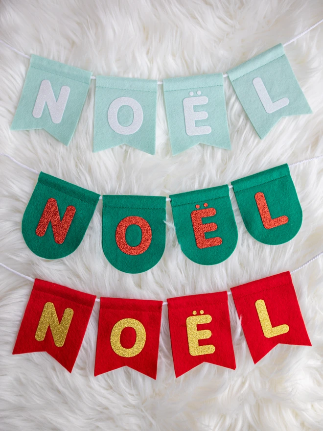 3 sets of felt NOËL bunting in pale mint, holly green and red all with glittery text.