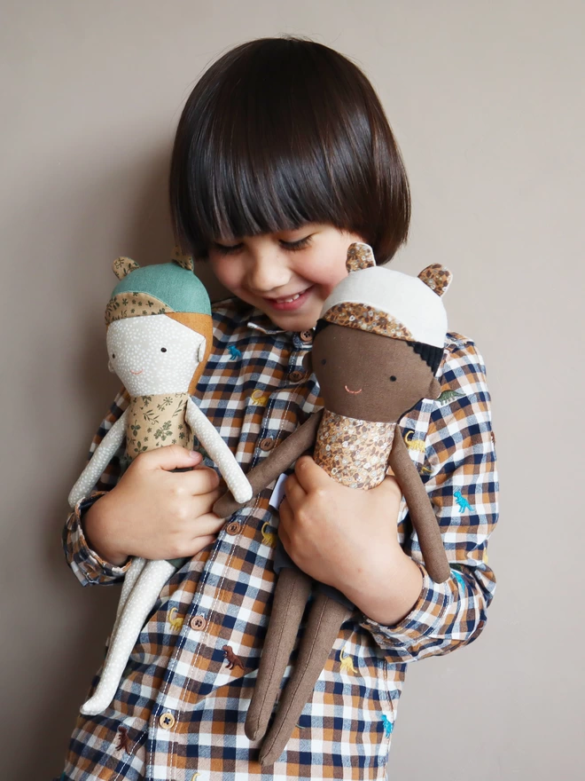 fabric dolls with dark skin and freckled face