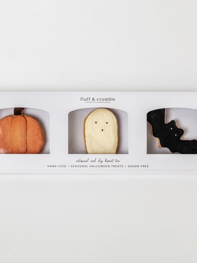 Boxed Halloween iced dog biscuit trio featuring a pumpkin, ghost and black bat.