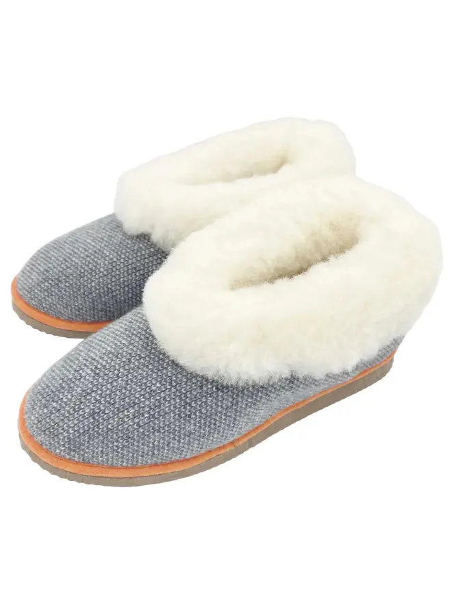 Women's Lambswool & Sheepskin Boot Slippers, a pair of boot slippers sitting on a plain white floor. 