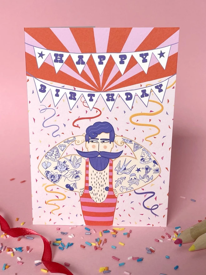 Tattooed Strongman Birthday Card
with pink background