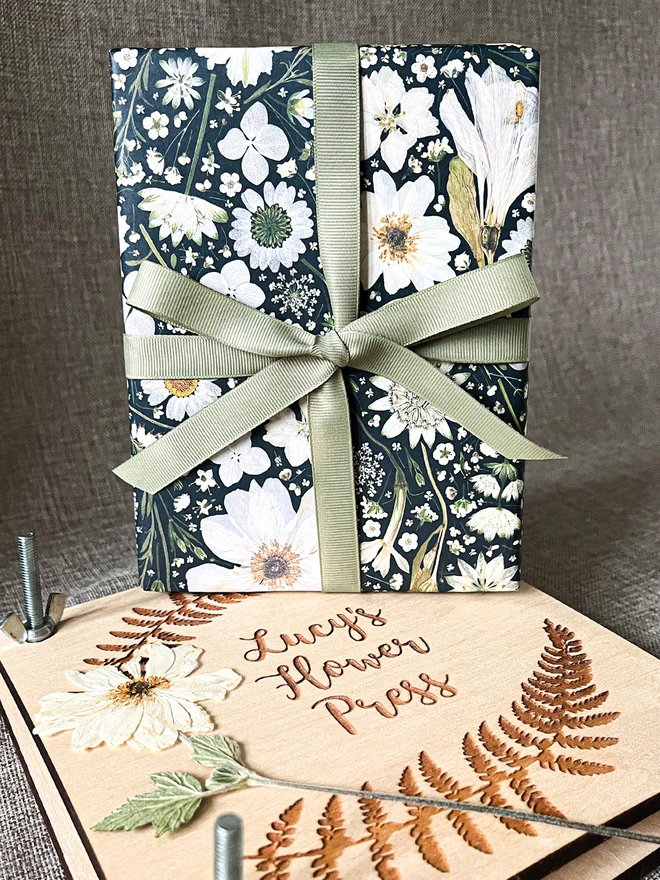 Luxury gift wrap paper sheets created from pressed white flowers, including Nigella, Daisy, Astrantia, Queen Anne's Lace, Hydrangea, Cow Parsley and Heather.