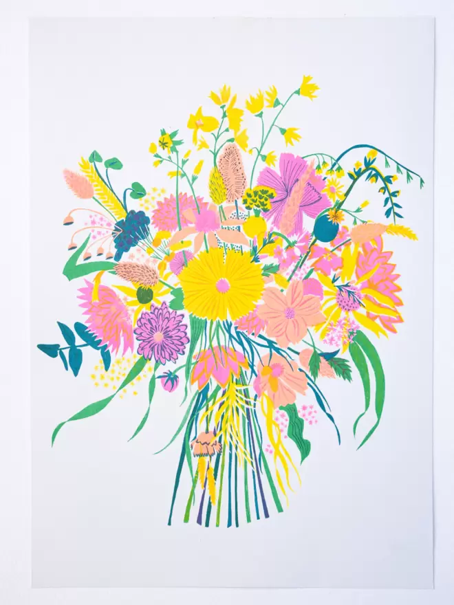 Full shot of image on wooden table: bouquet of wildflowers, in bright and cheerful yellow tones.