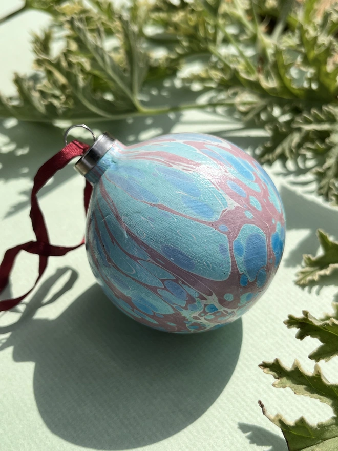 Hand-marbled round ceramic Christmas bauble