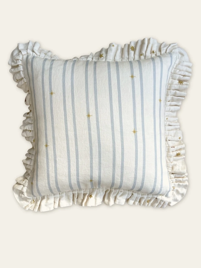 'Astral Weeks' Linen Ruffled Cushion Cover, a white and yellow cushion with a sun motif. 