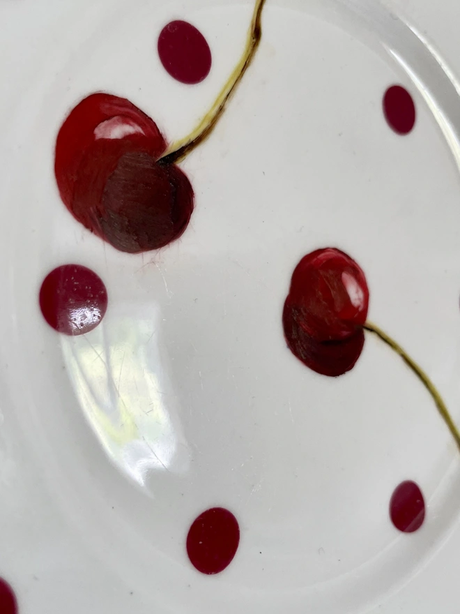 detail of painting on dotty plate
