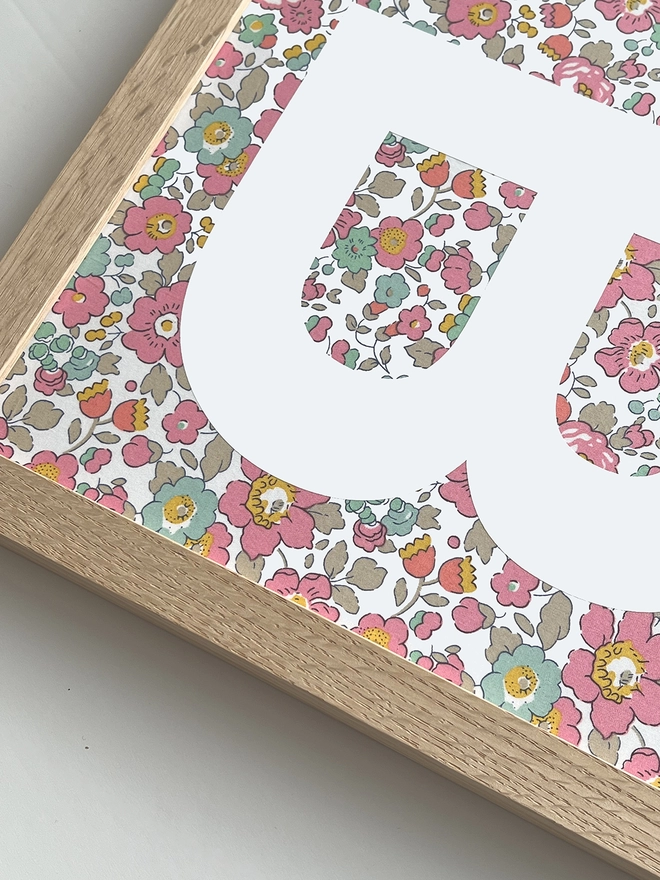 Personalised framed white initial on Liberty Betsy pink fabric - close up