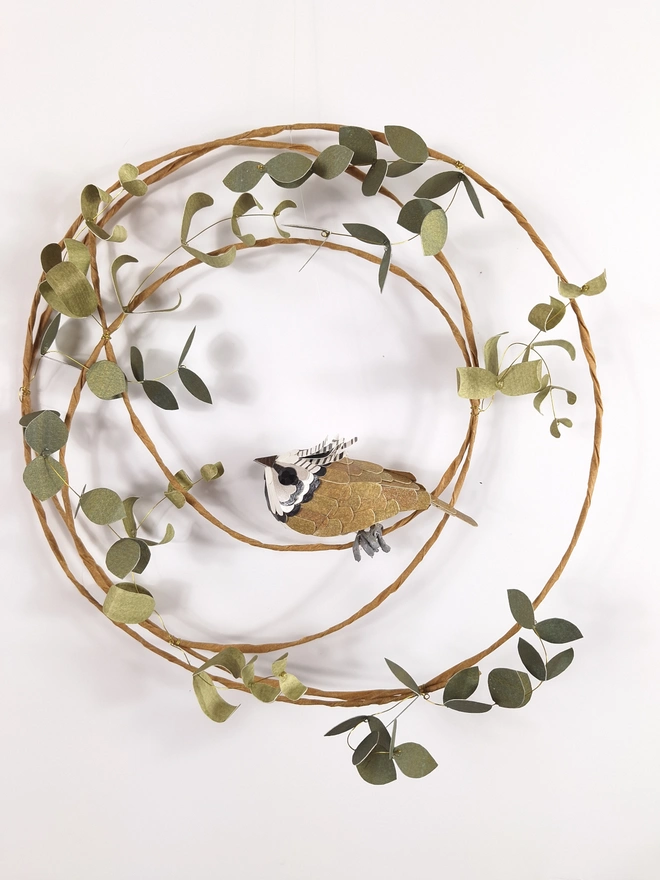 crested tit sculpture on a leafy wreath