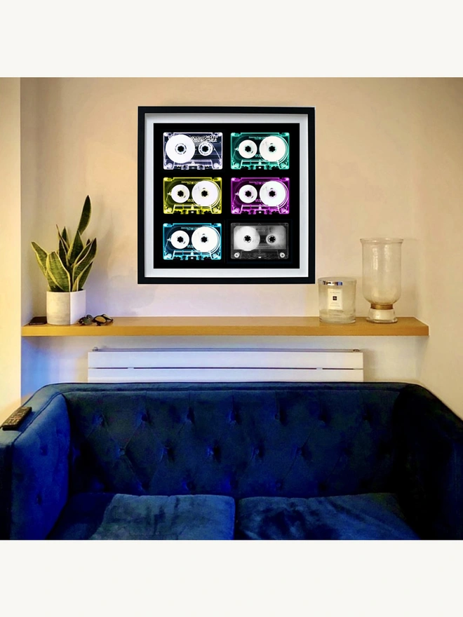Tape Collection Framed in Black on the living room wall