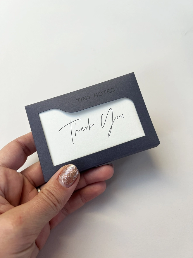 Boxed letterpress tiny note illustrated with a thank you in modern calligraphy