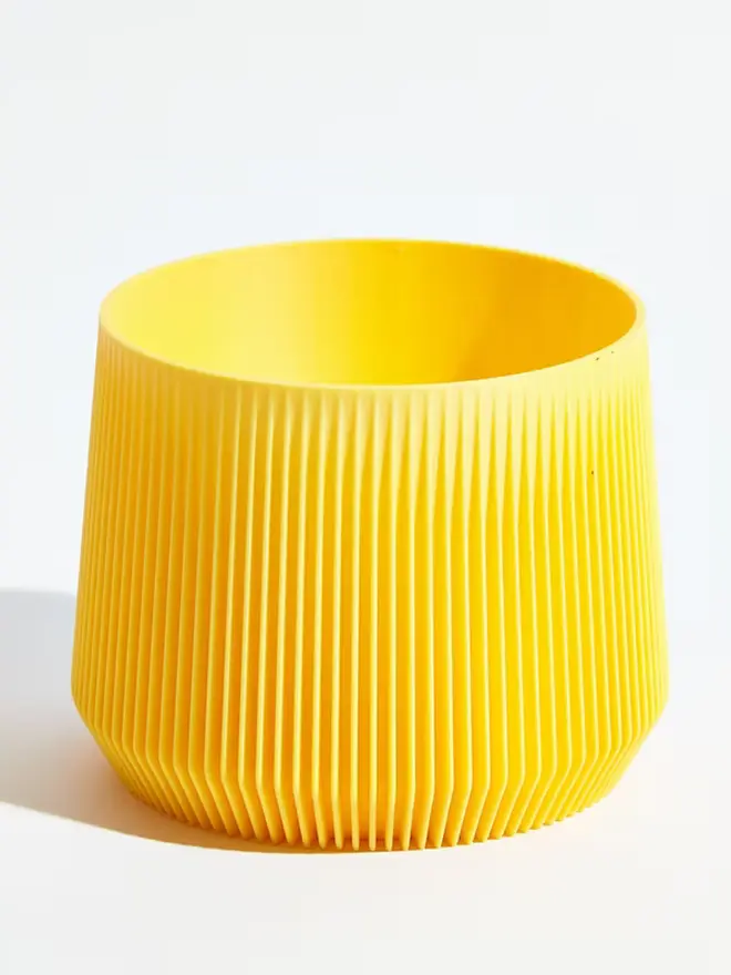 Sustainable 3D Printed Banana Yellow Plant Pot, pillar design, against a white background.