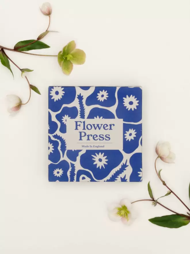 Bold floral print flower press packaging.