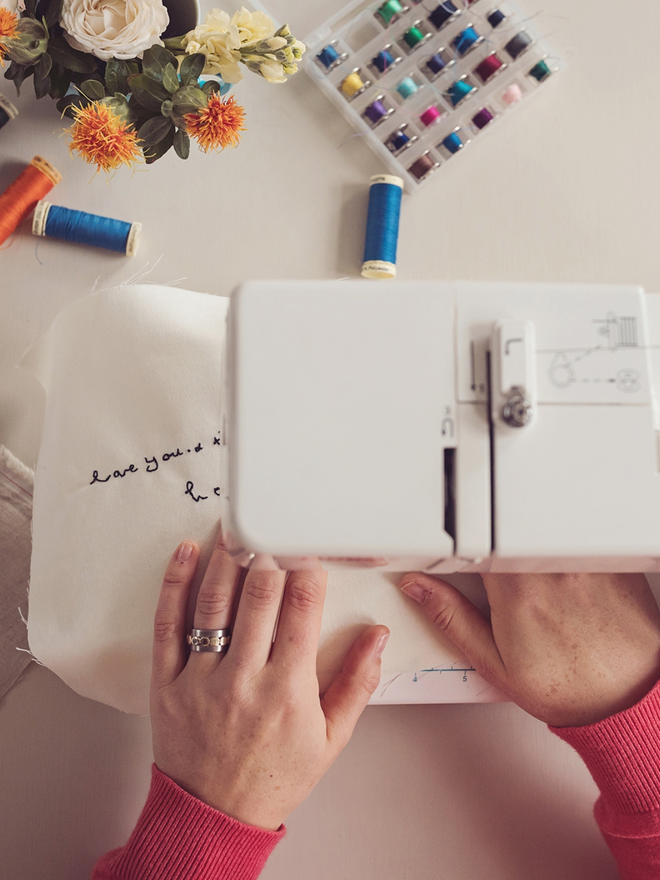 view from above of sewing words using freehand machine embroidery