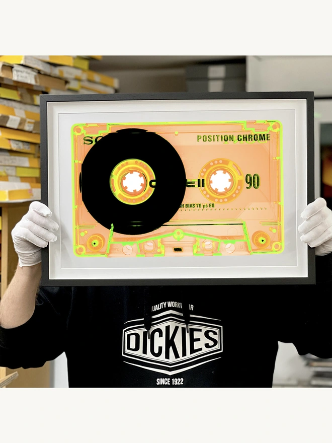 Richard holding Heidler and Heeps Tape Collection Chrome Tutti Frutti framed in black