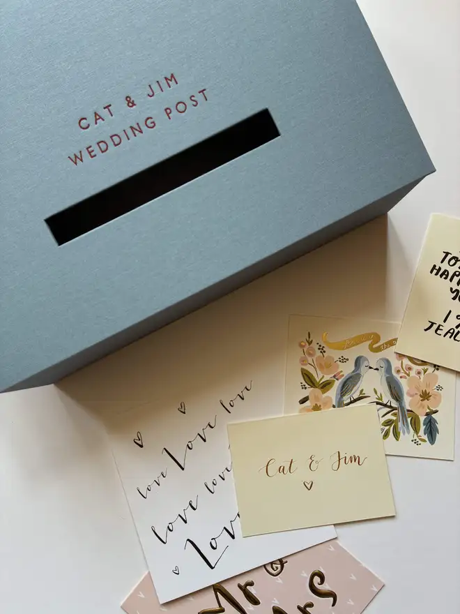 Closed handmade wedding post box in powder blue book cloth with personalised foiled lettering