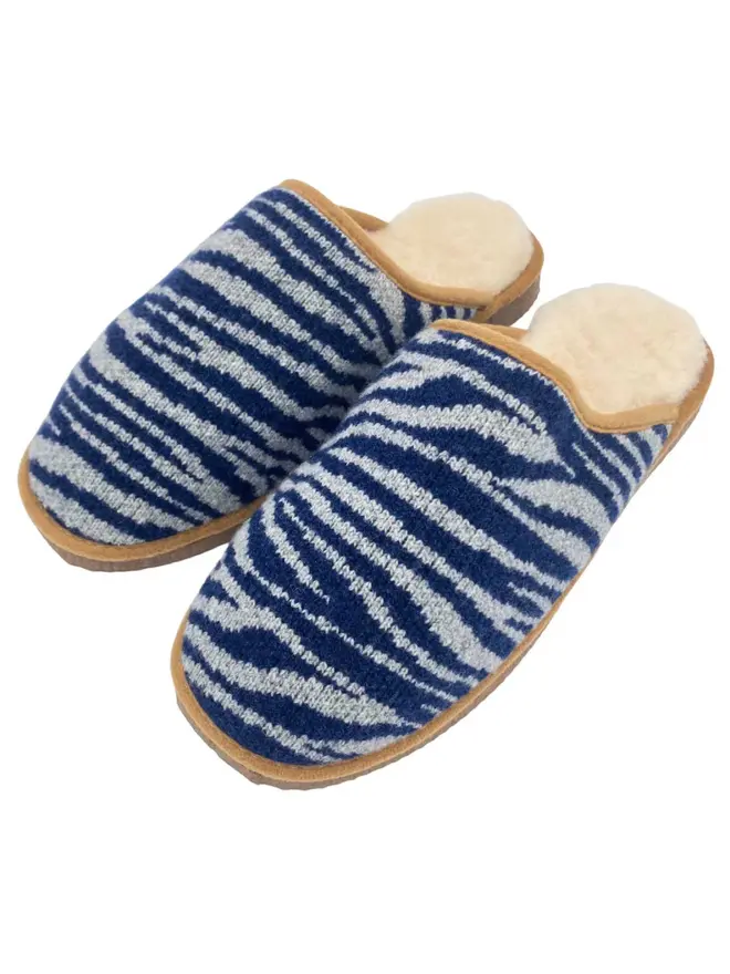 Women's Lambswool & Sheepskin Boot Slippers, a pair of boot slippers sitting on a plain white floor. 
