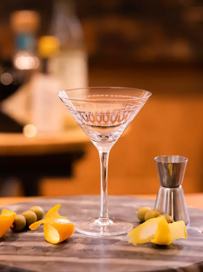 engraved ovals martini glasses (set of 2). a cocktail glass with an oval pattern.