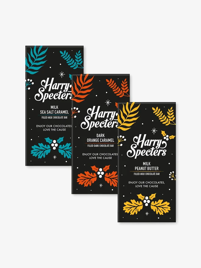 A bundle of three filled chocolate bars in Christmas packaging by Harry Specters